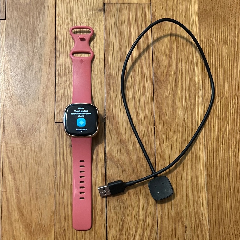 Fitbit Versa 4 Smartwatch with Pink Band & Charger